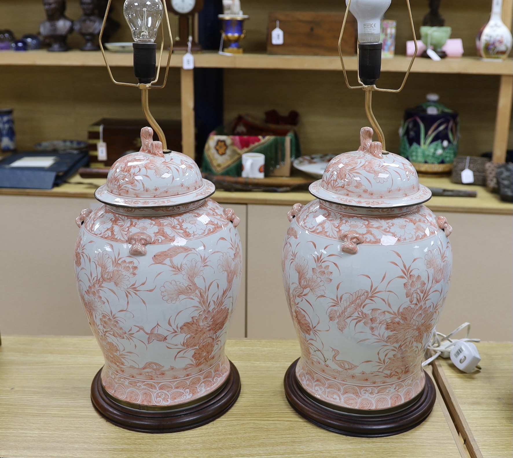 A pair of Chinese style iron red porcelain table lamps